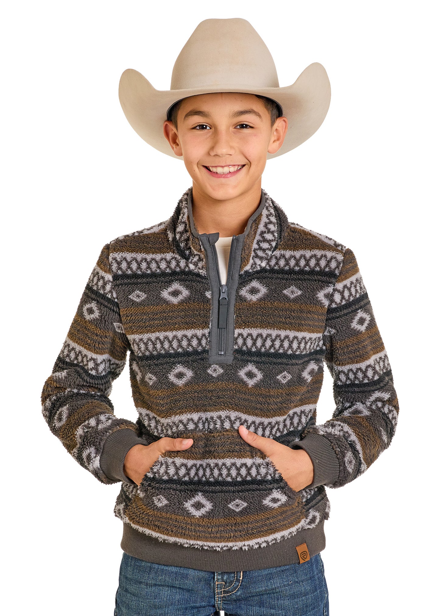 Child wearing a patterned sweater and cowboy hat on a white background