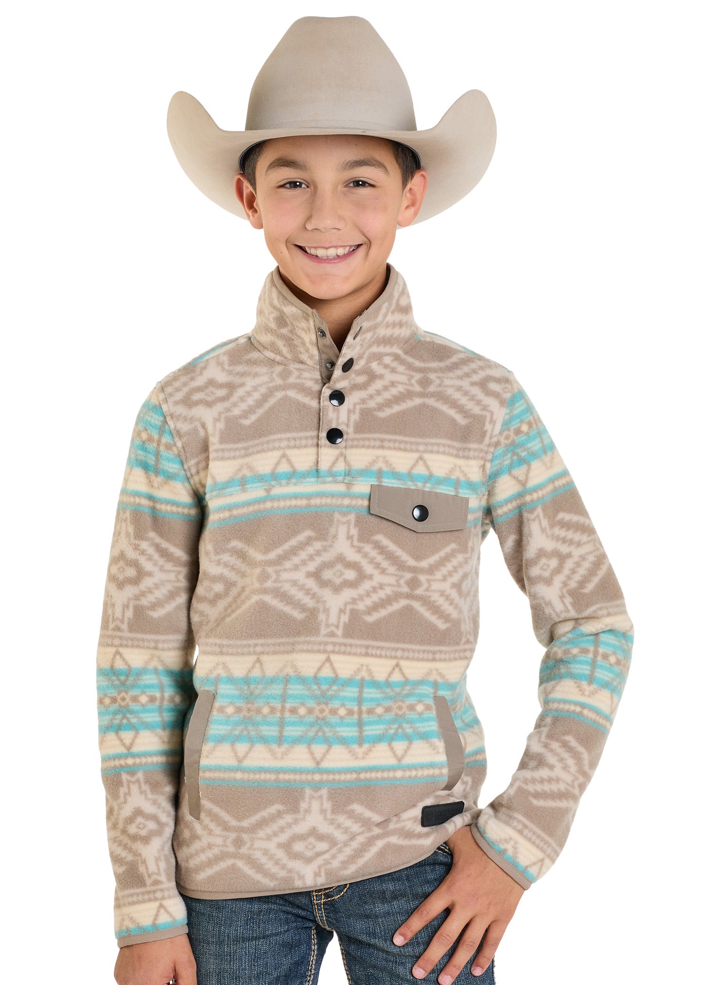Child wearing a patterned long-sleeve shirt and cowboy hat on a white background