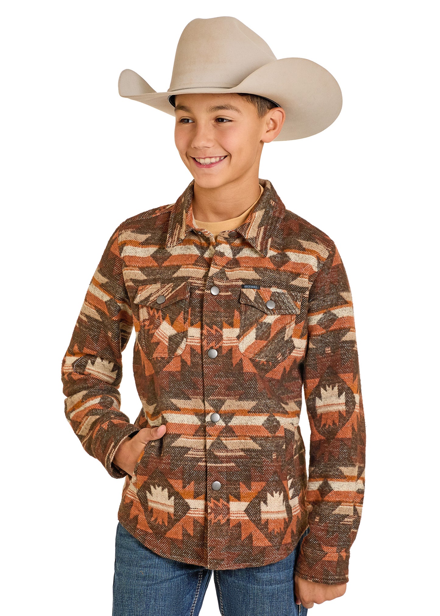 Child wearing a patterned shirt and cowboy hat on a white background