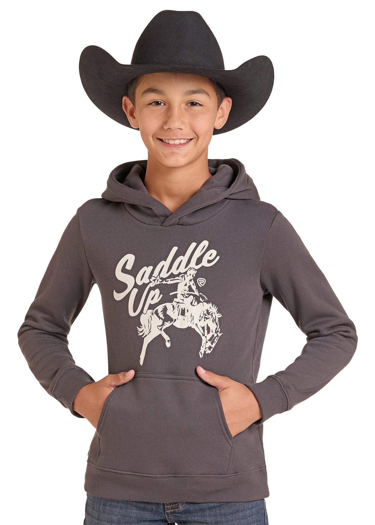 A smiling boy wearing a dark gray hoodie with a white 'Saddle Up' western rider graphic and a black cowboy hat, standing against a white background.