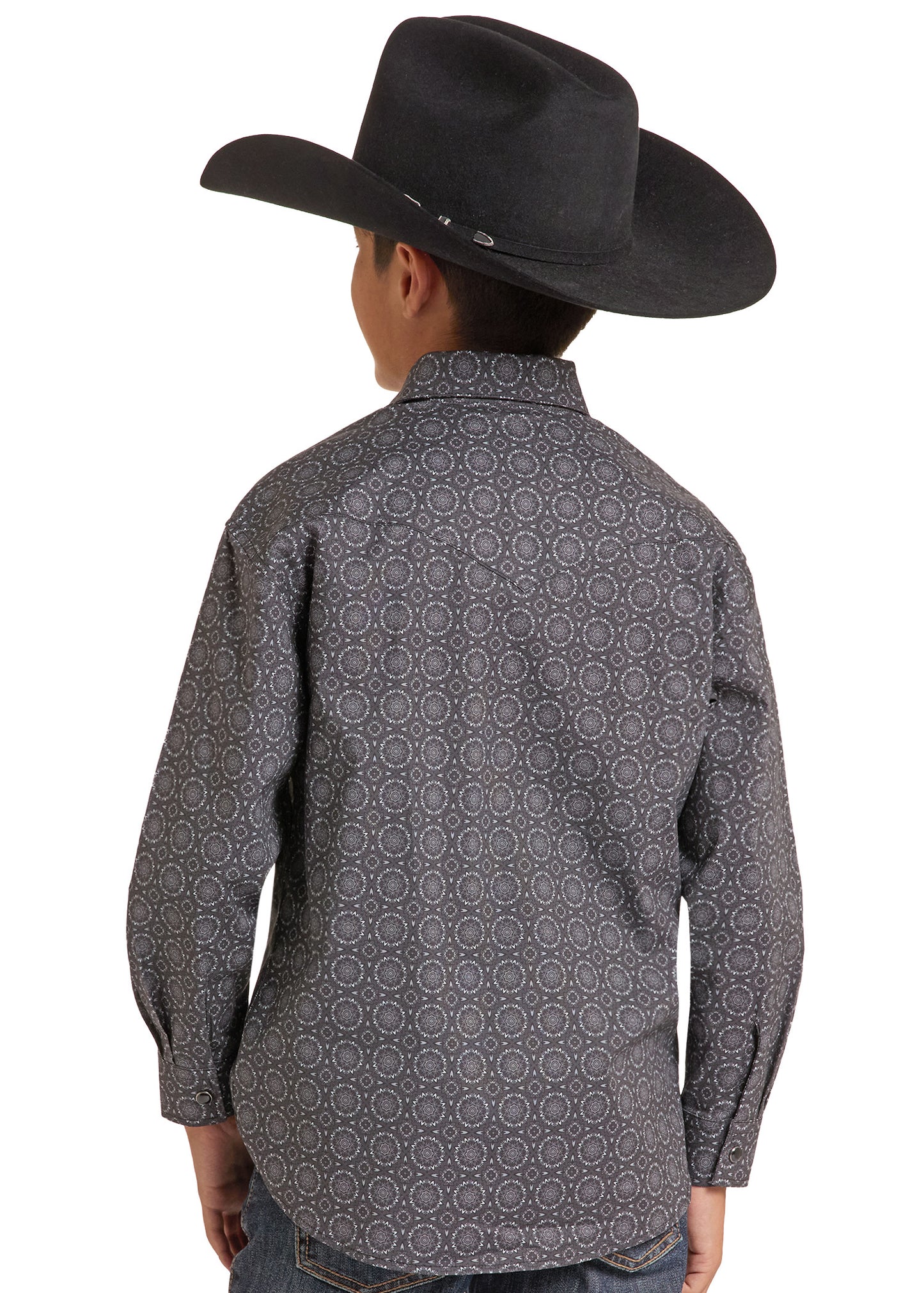 A child wearing a black cowboy hat and a dark gray long-sleeve western shirt with a light geometric pattern, shown from the back against a white background.