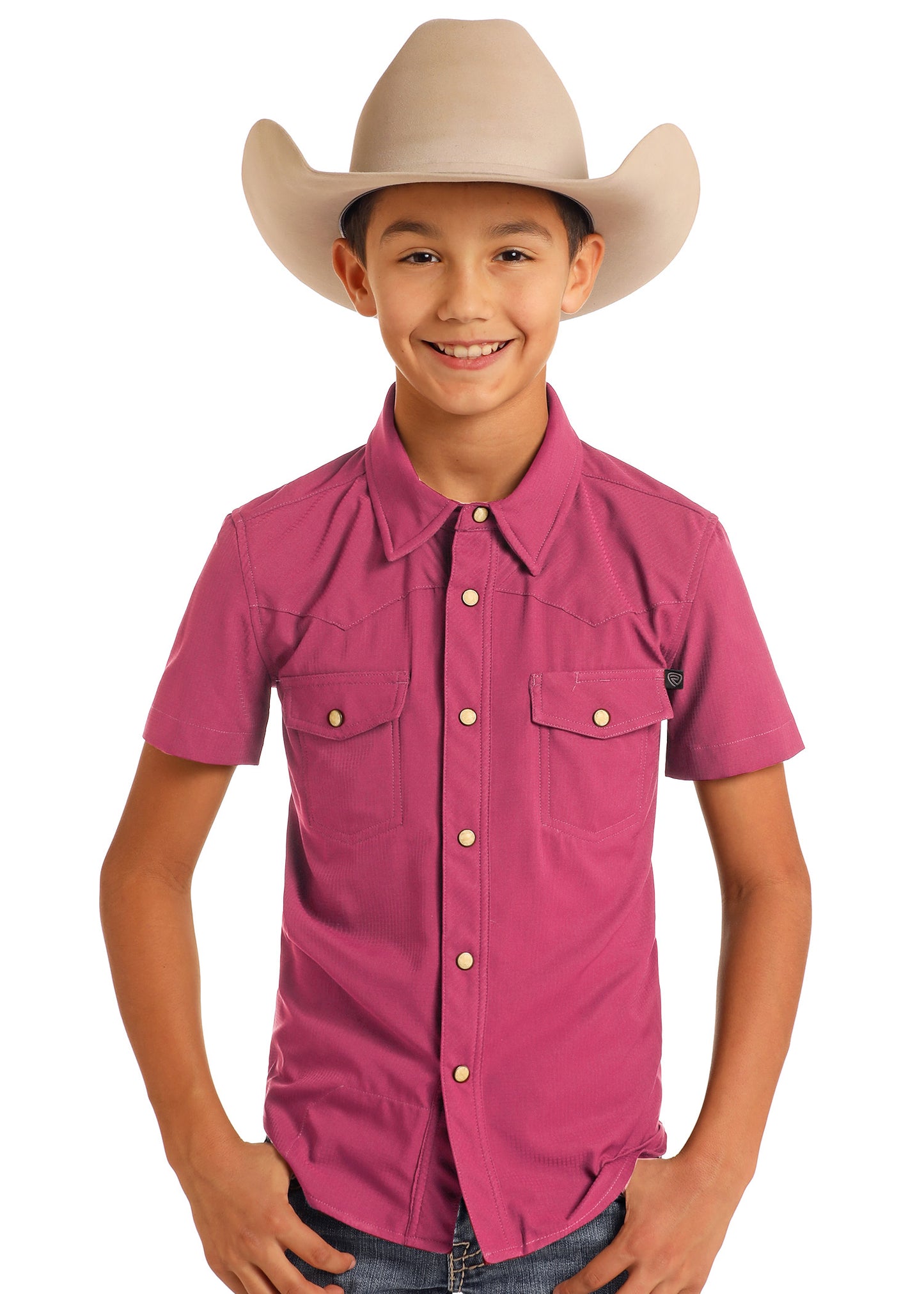 Child wearing a pink shirt and beige cowboy hat on a white background