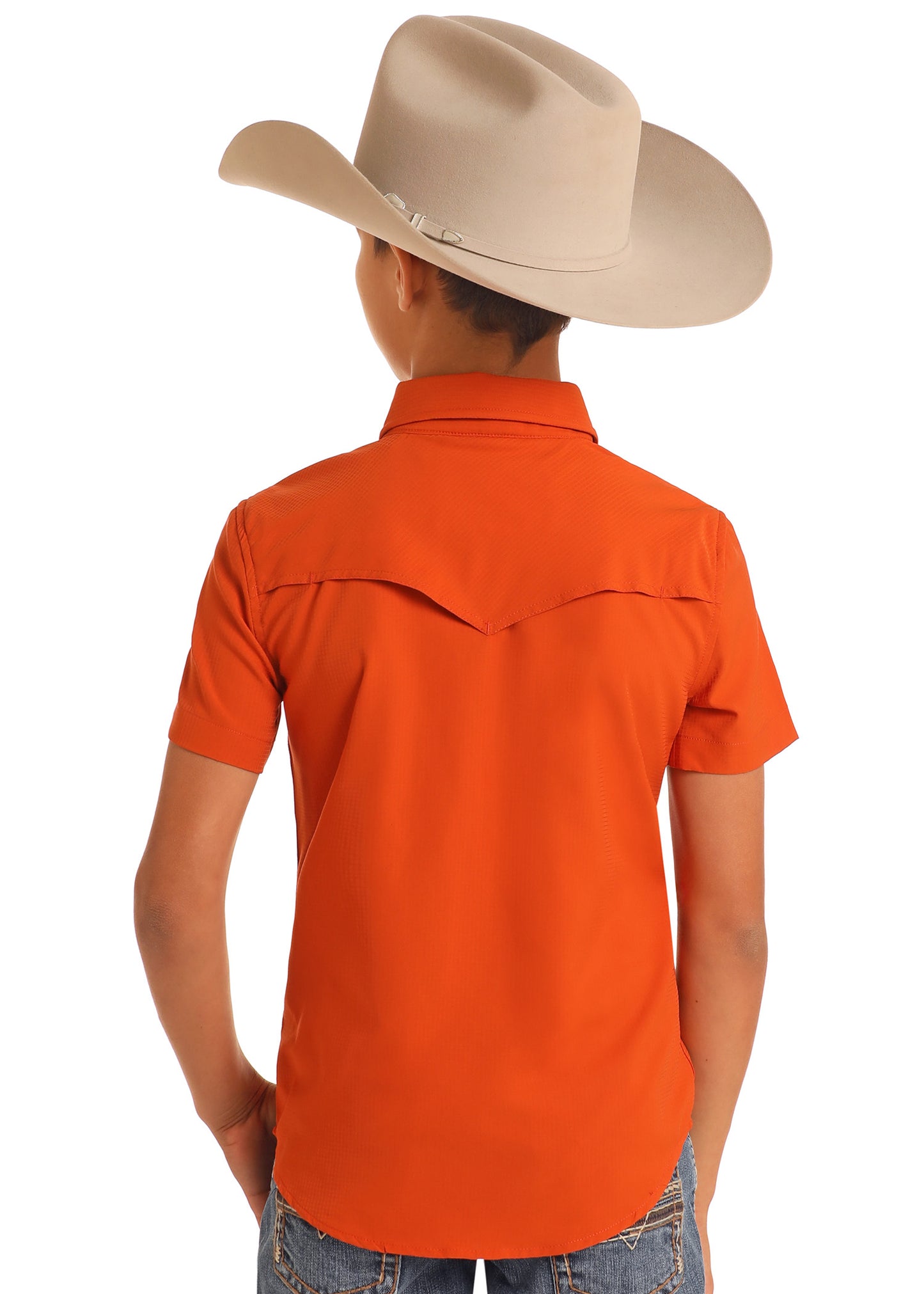 Person wearing an orange shirt and beige cowboy hat on a white background