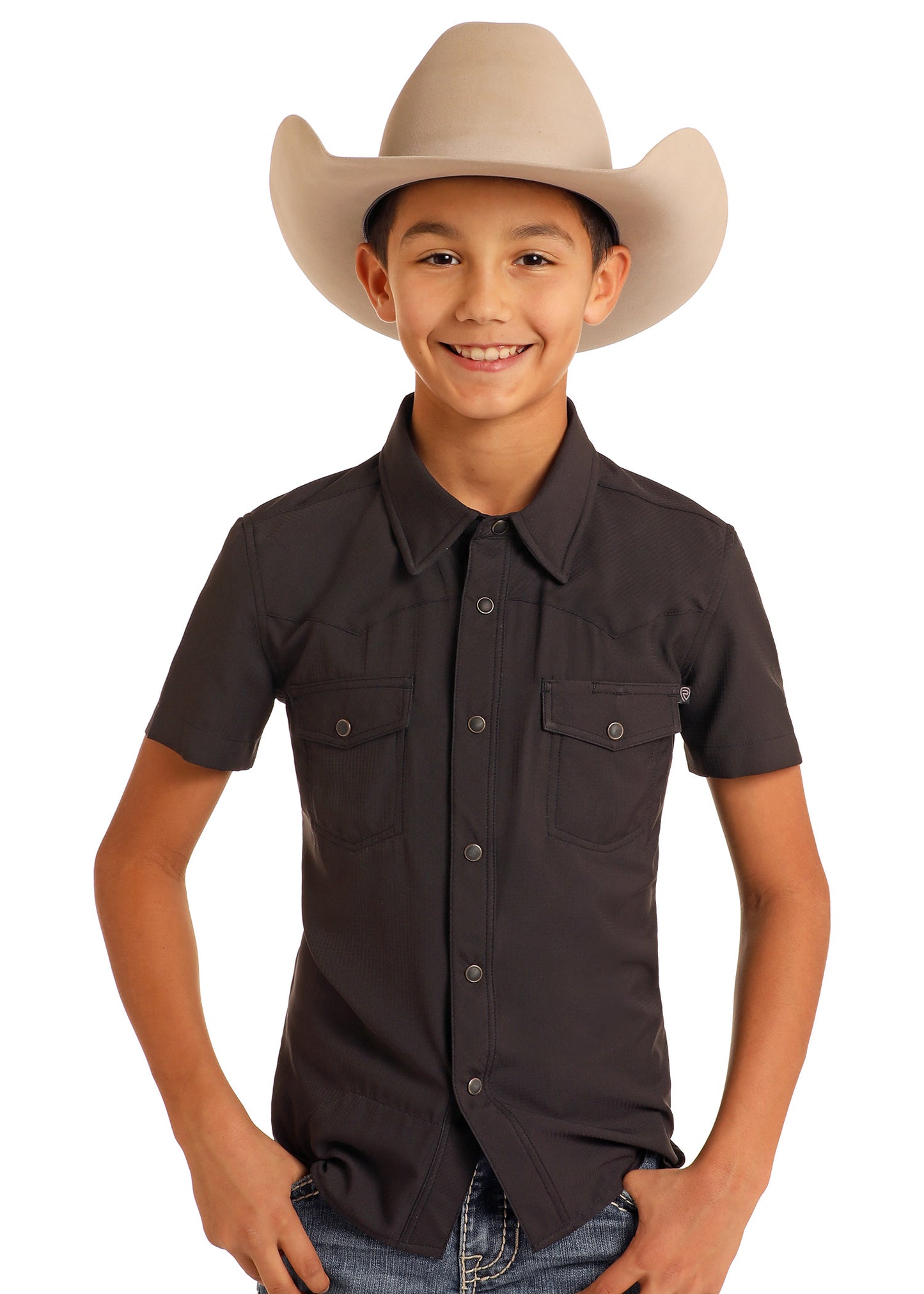 Child wearing a dark brown shirt and beige cowboy hat on a white background