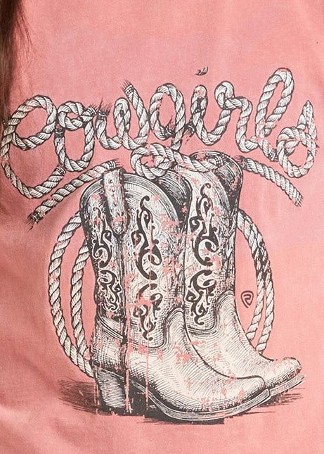Young girl wearing a pink graphic t-shirt with a cowboy boot design and a beige cowboy hat.