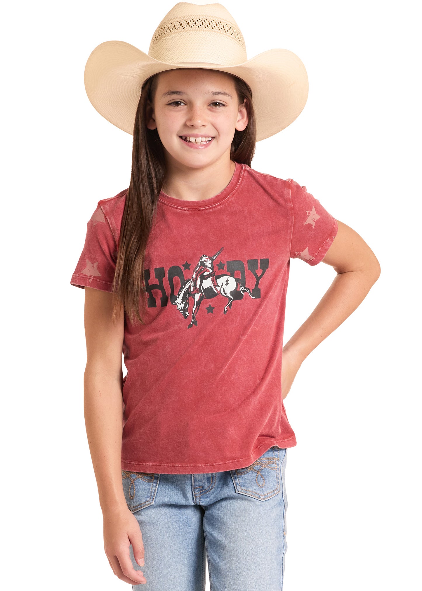 Young girl wearing a red t-shirt with a horse graphic and a cowboy hat on a white background