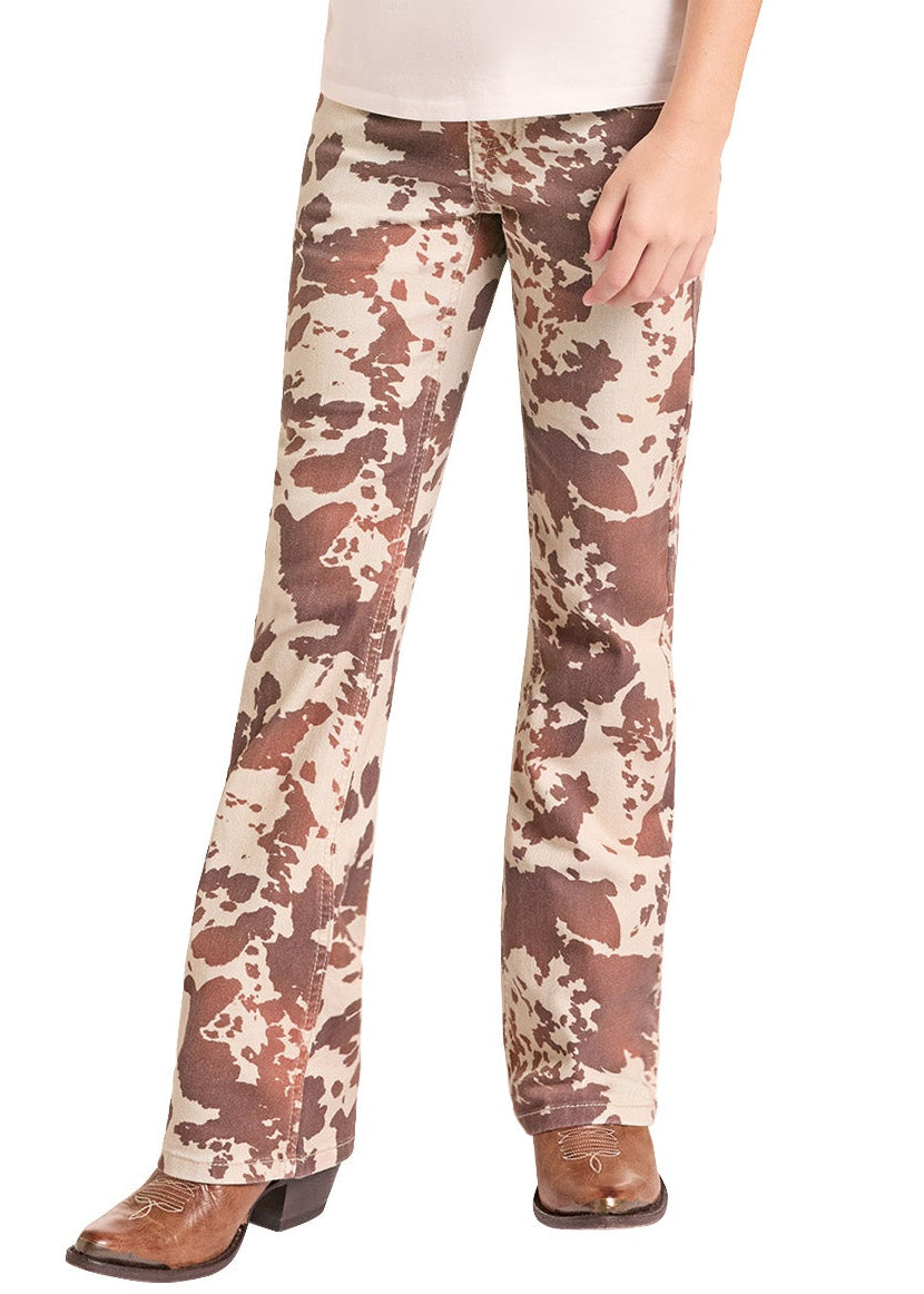 A young girl modeling a western-themed raglan t-shirt with a horse graphic, matching camouflage pants, a cowboy hat, and cowboy boots against a white background.