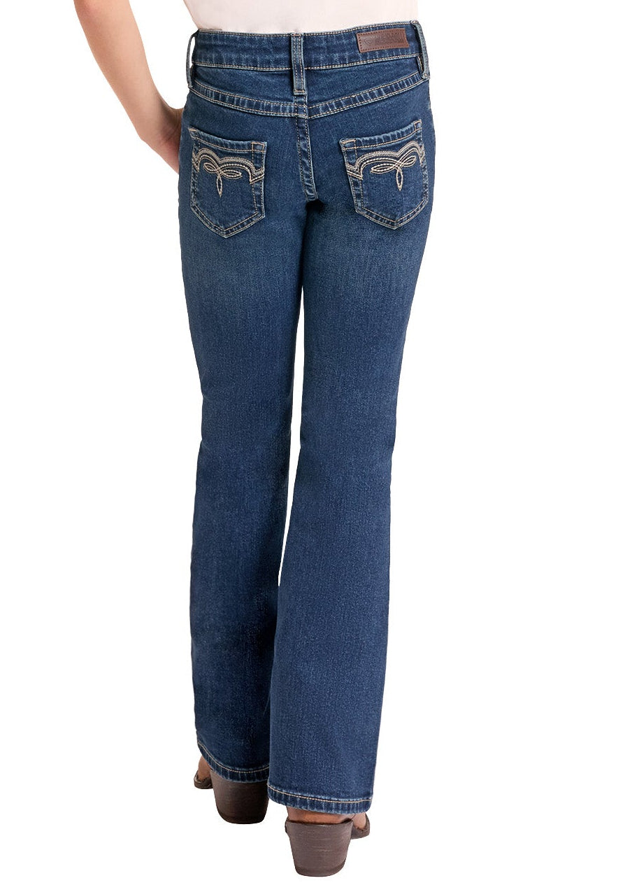 A woman shown from the back wearing a beige cowboy hat, a white and dark brown raglan t-shirt, blue jeans, and brown shoes, set against a plain white background.
