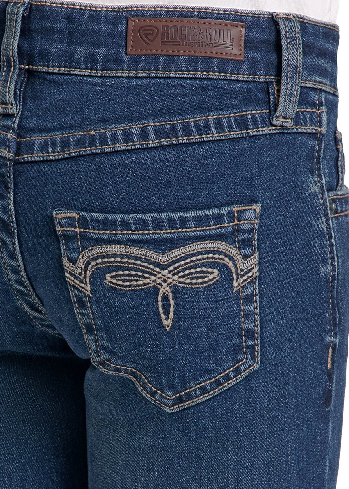 Close-up of the back waistband and pocket area of dark blue denim jeans, showing a brown leather patch with the brand name 'Roxanne' and decorative contrast stitching.