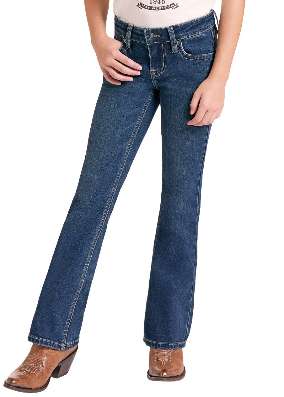 A young girl modeling a western-style raglan t-shirt with a brown graphic, blue jeans, a beige cowboy hat, and brown cowboy boots against a white background.