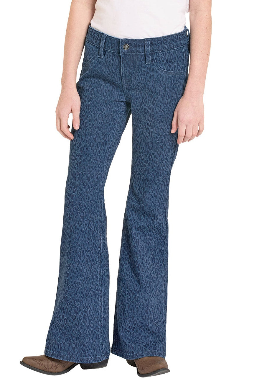 Girl wearing a white shirt, blue patterned Flare printed jeans on a white background