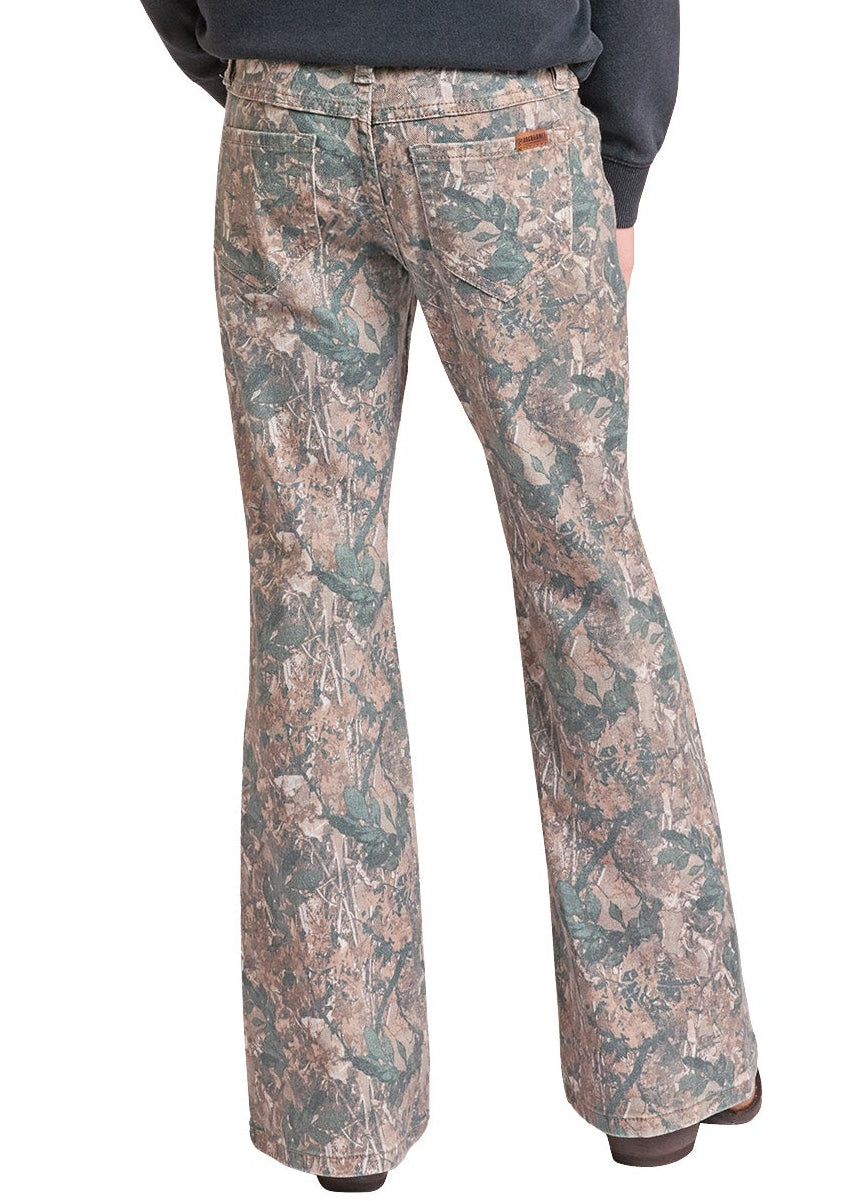 A girl shown from the back wearing a light beige cowboy hat, a dark charcoal long-sleeve top, and camouflage-patterned western flare pants against a plain white background.