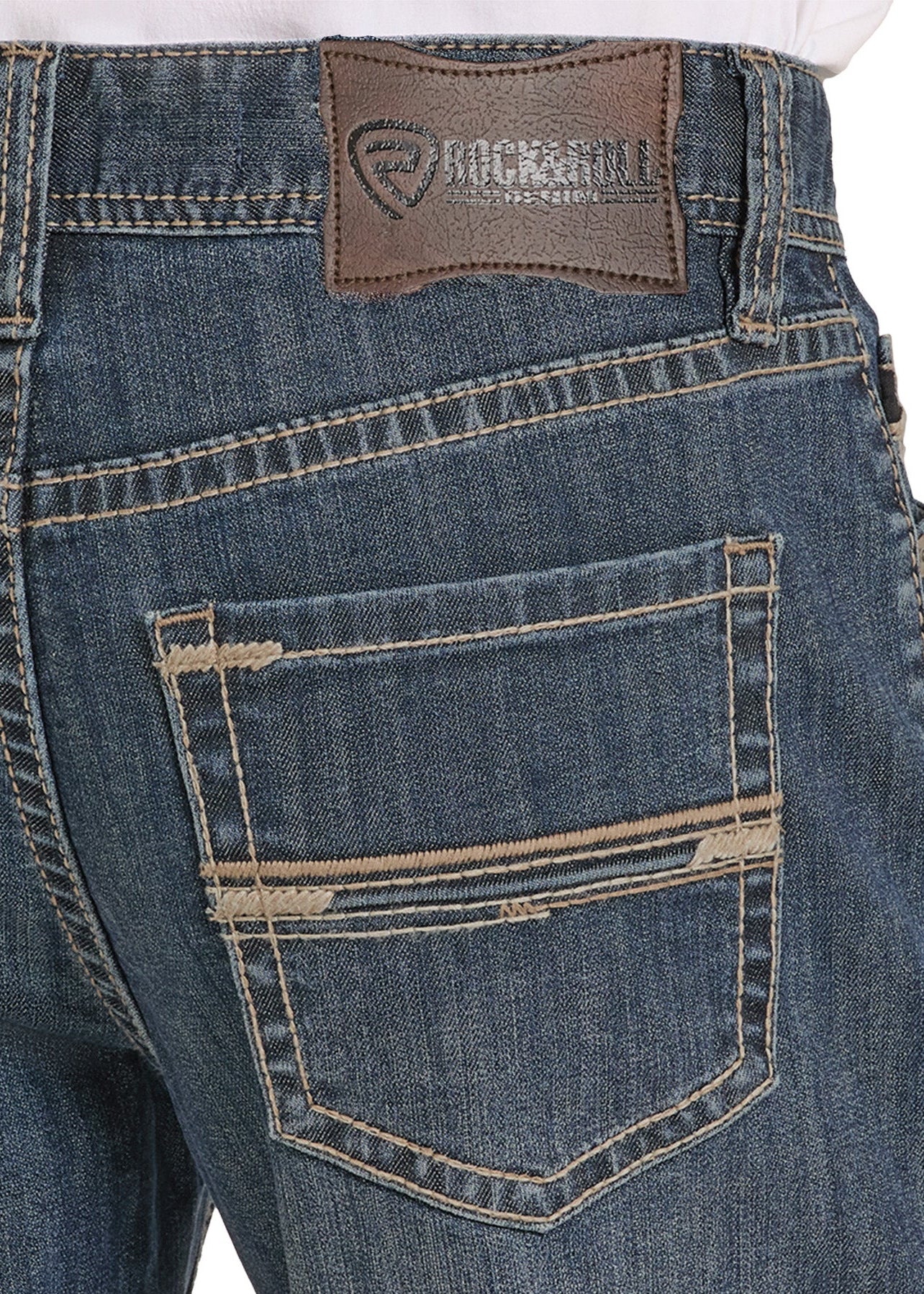 Close-up of blue jeans with a brand label on a white background