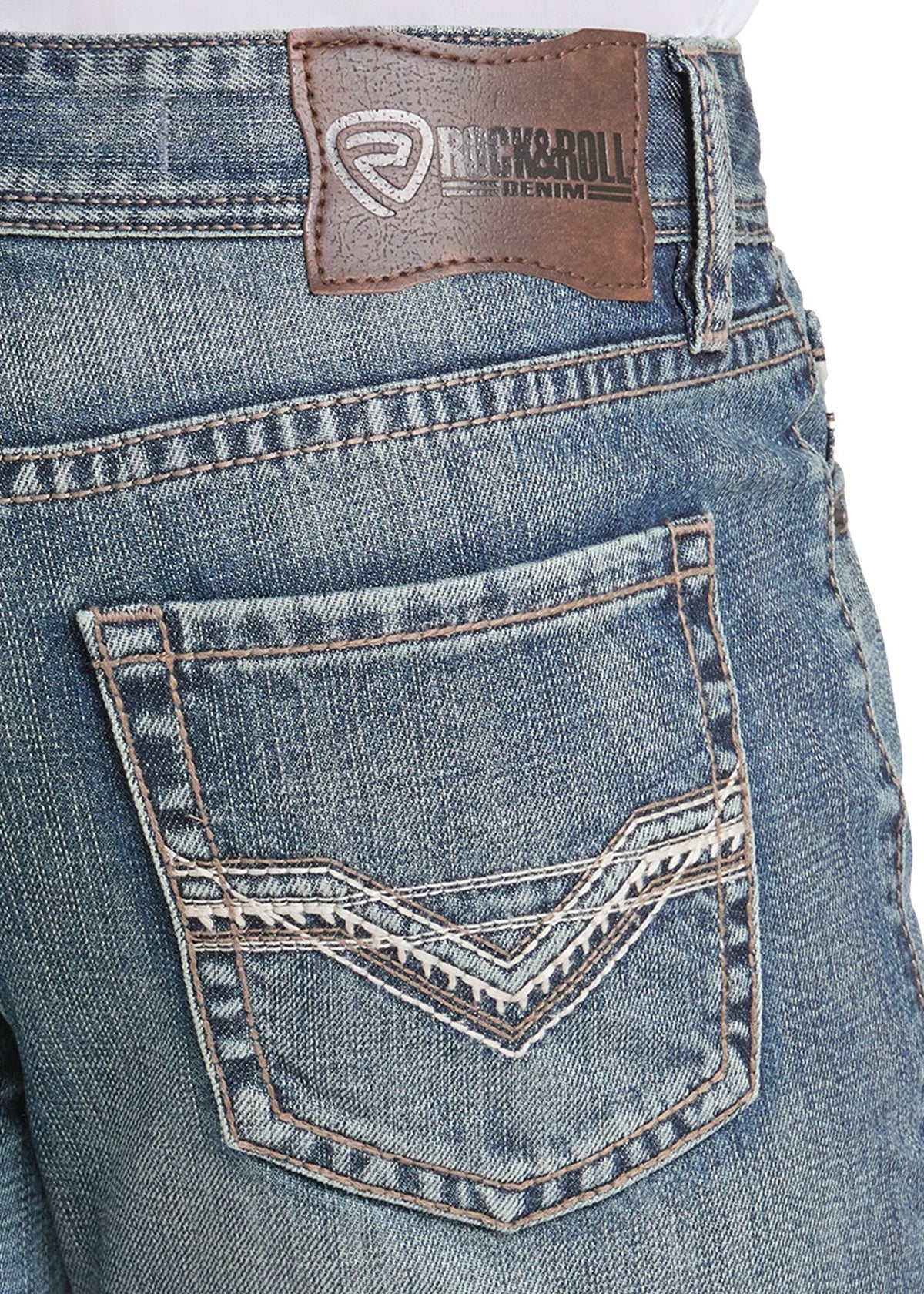 Close-up of the back waistband and pocket area of blue denim jeans, showing a brown leather Rick & Roll brand patch and decorative contrast stitching on the back pocket.