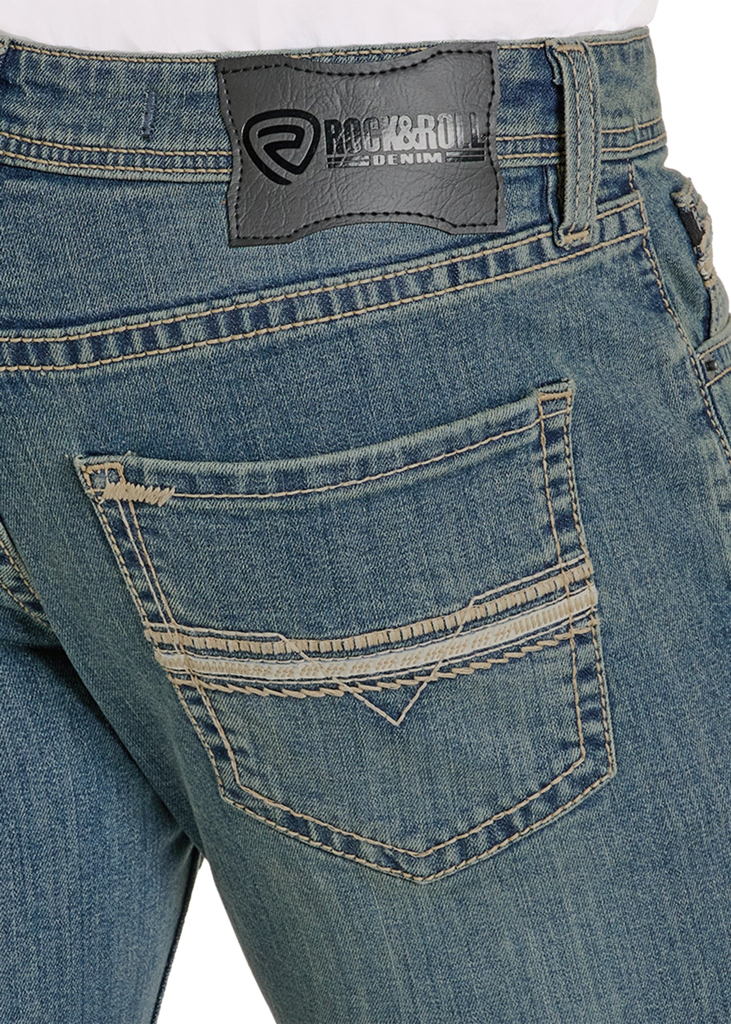 Close-up of blue jeans with a brand label on a white background