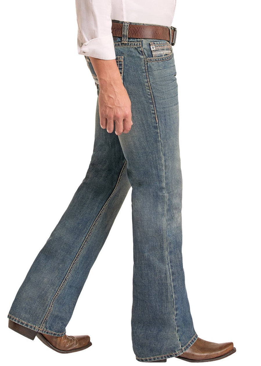 A man wearing a black cowboy hat, a white long-sleeve button-down shirt, blue jeans, and brown boots, shown in profile against a plain white background.