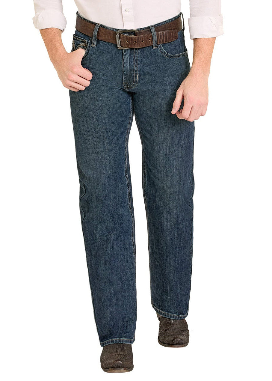 Man wearing a beige shirt, blue jeans, and a cowboy hat on a white background