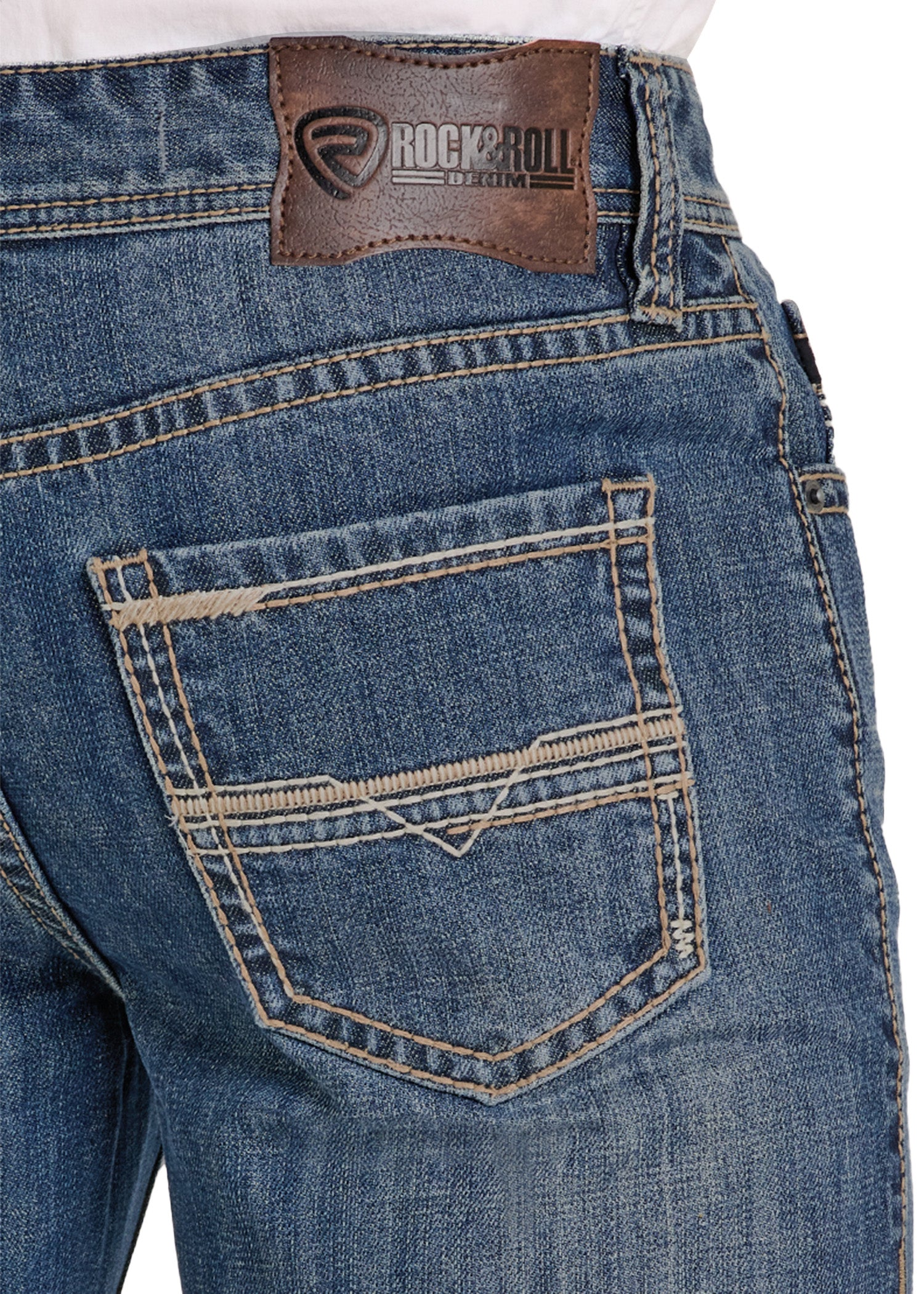 Close-up of blue jeans with a leather patch and 'Rock & Roll' branding.