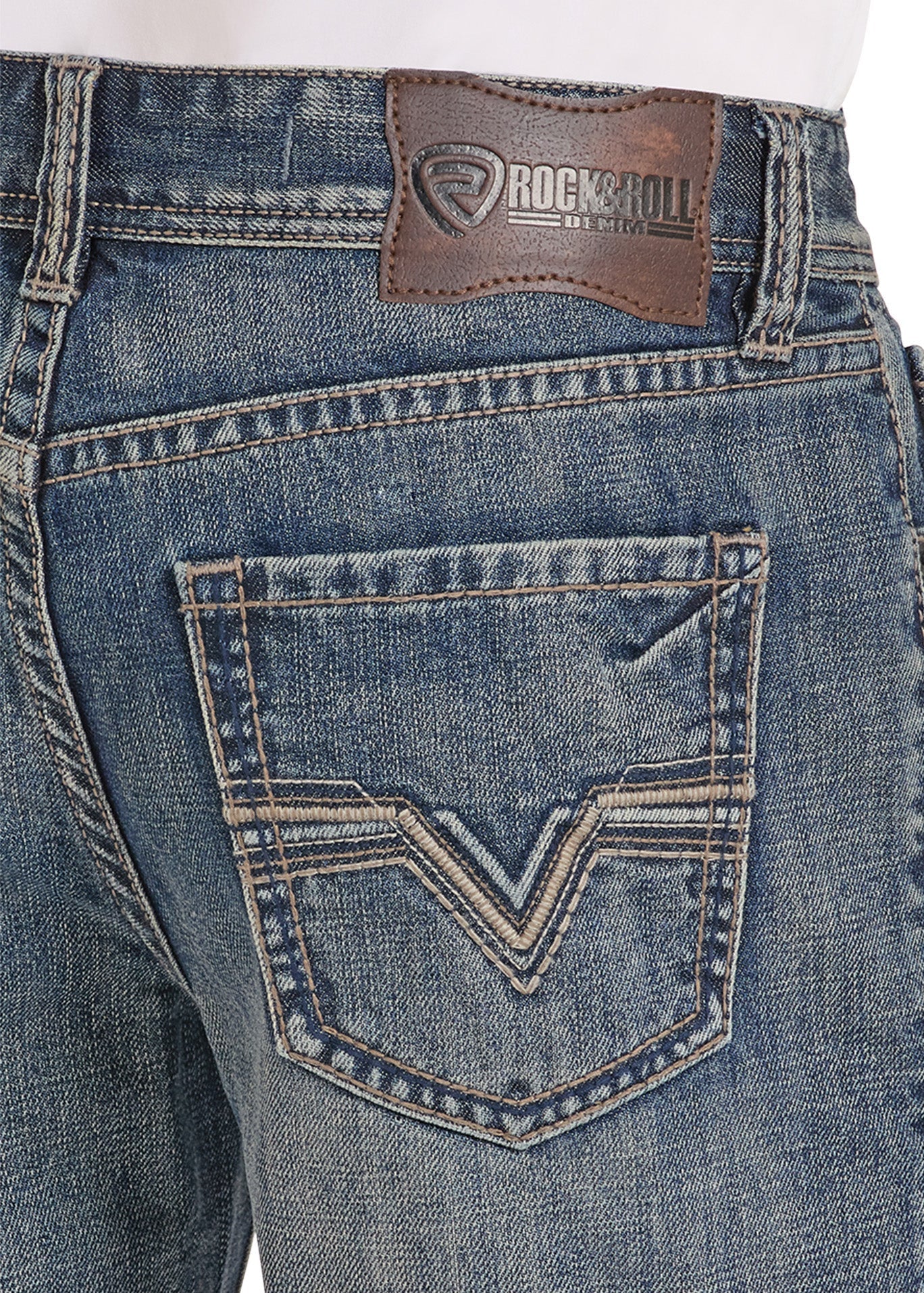 Close-up of blue jeans with a brand patch on the back pocket.