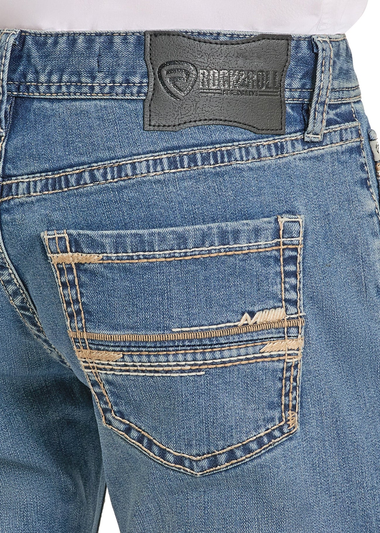 Close-up of blue jeans with a brand label on the pocket