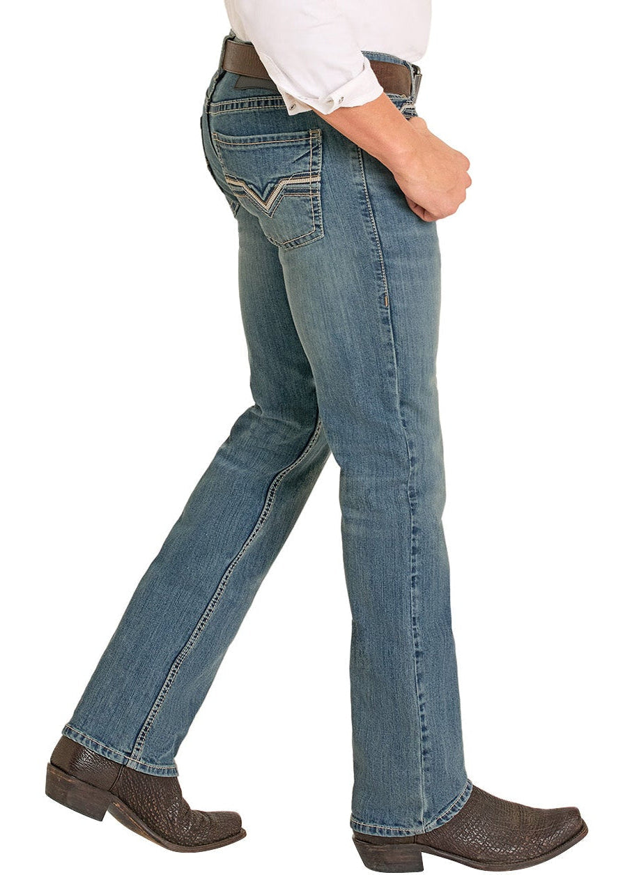 Man wearing a cowboy hat, white shirt, and blue jeans on a white background