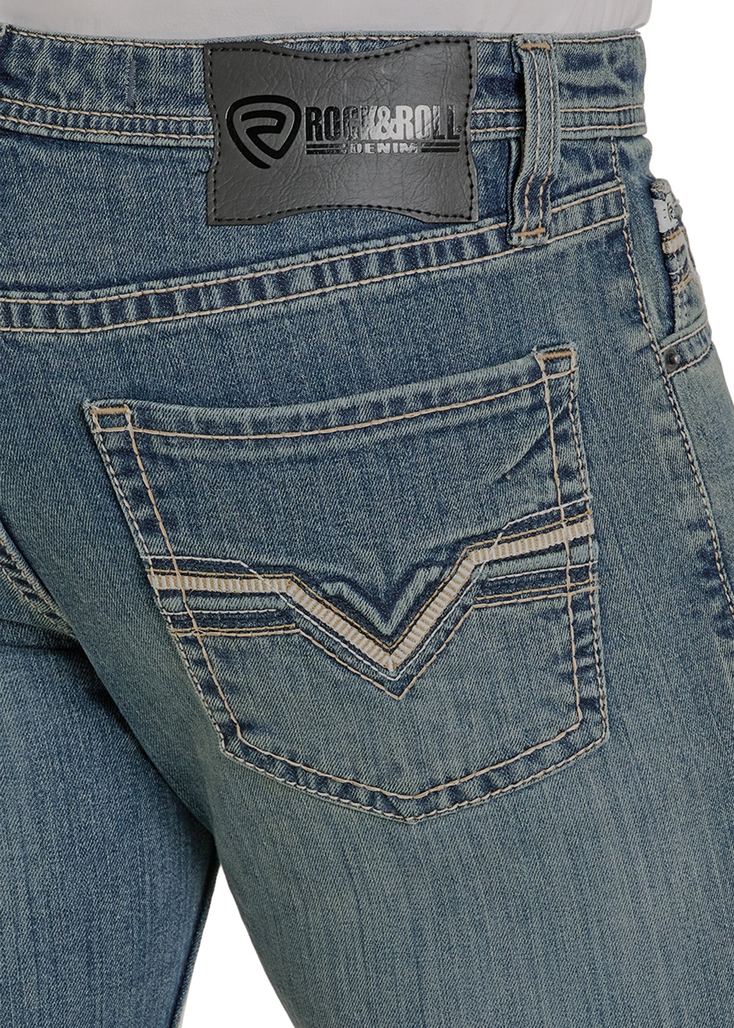 Close-up of blue jeans with a brand label on the back pocket.