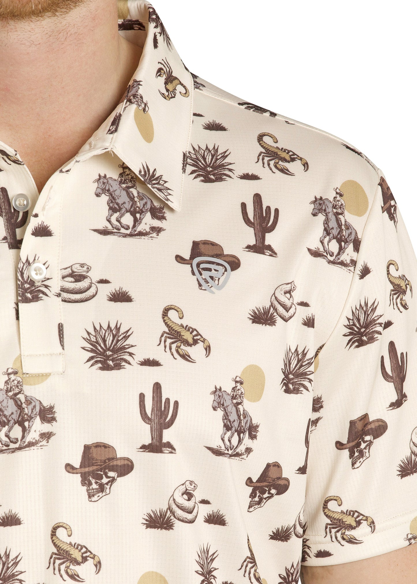 Close-up of a shirt with a western-themed pattern featuring horses, hats, and cacti.