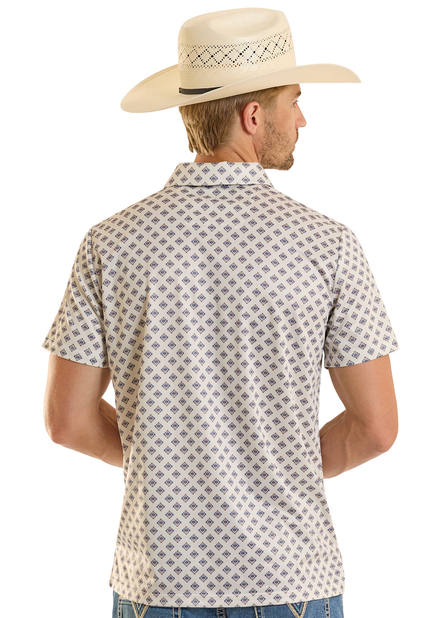 Man wearing a patterned shirt and cowboy hat on a white background
