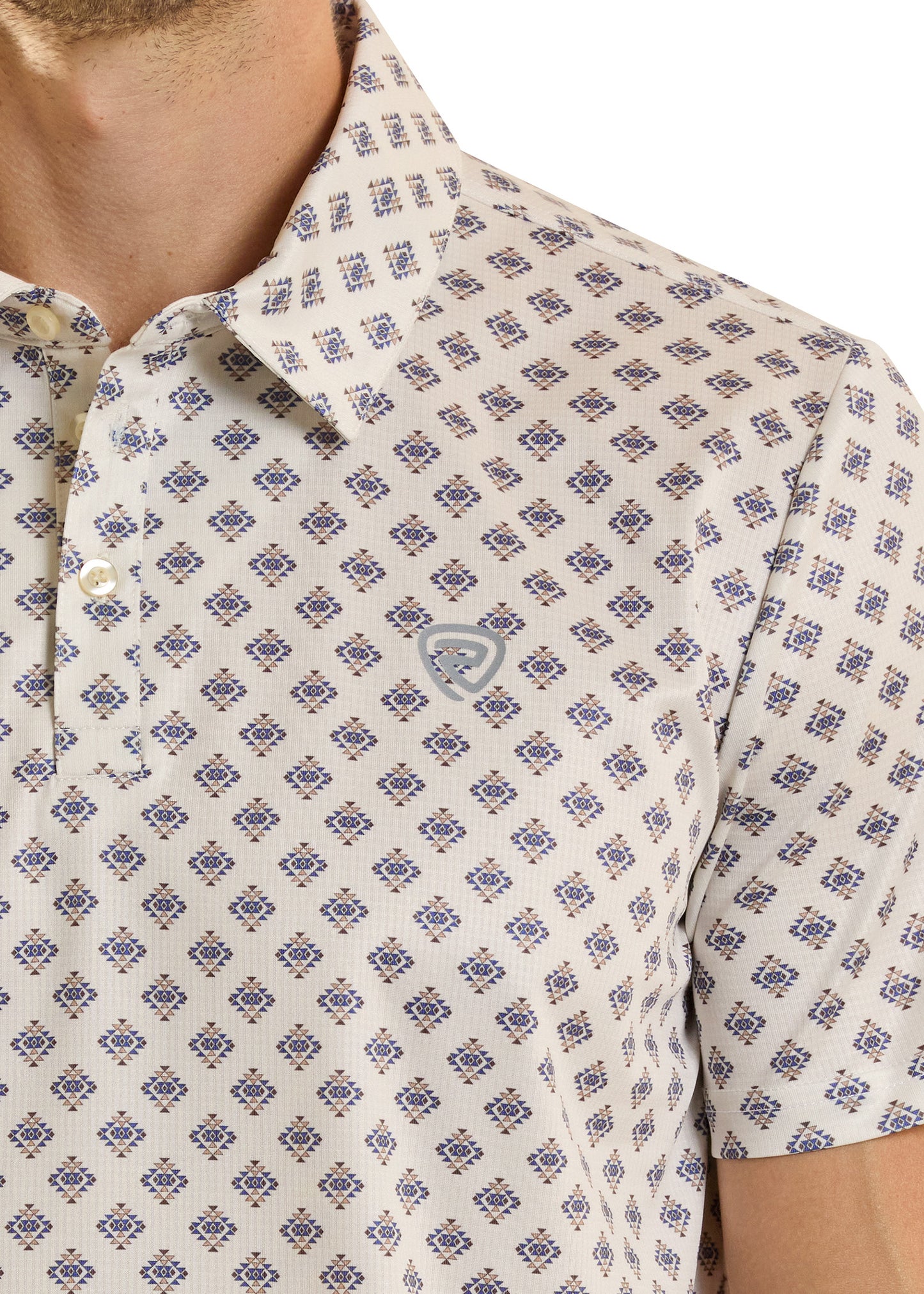 Close-up of a patterned shirt with a brand logo on a white background