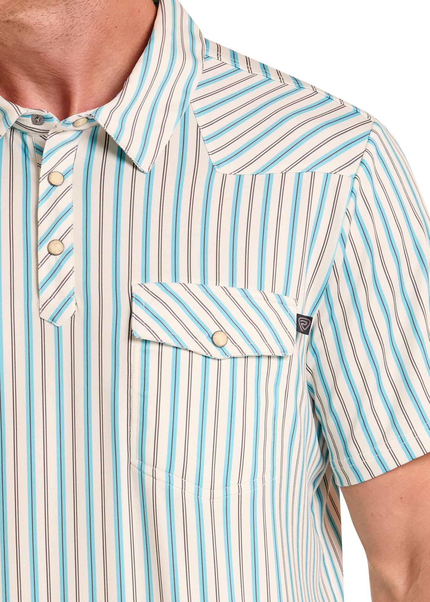 Close-up of a striped shirt with a pocket and button details.