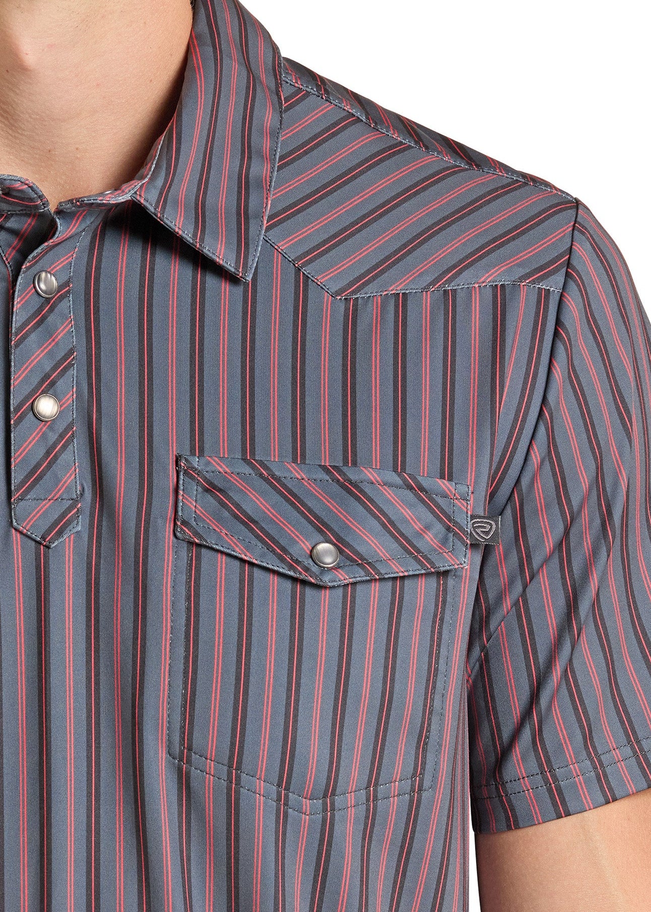 Close-up of a man wearing a short-sleeve western-style button-up shirt with vertical blue, red, and gray stripes, featuring a chest pocket with a snap button.