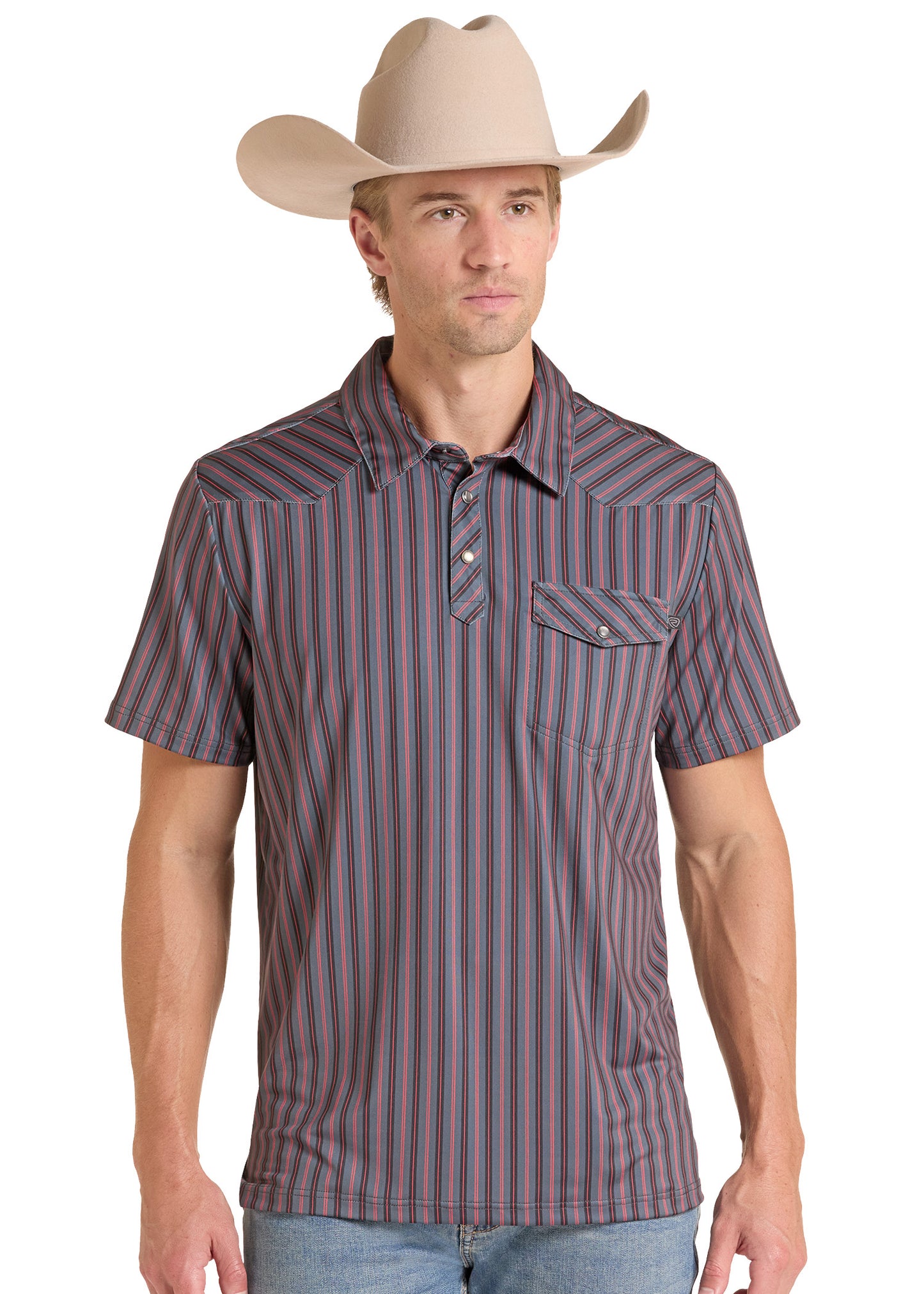 A man wearing a short-sleeve western-style button-up shirt with vertical stripes in brown, purple, and blue, paired with a beige cowboy hat and blue jeans, against a plain white background.