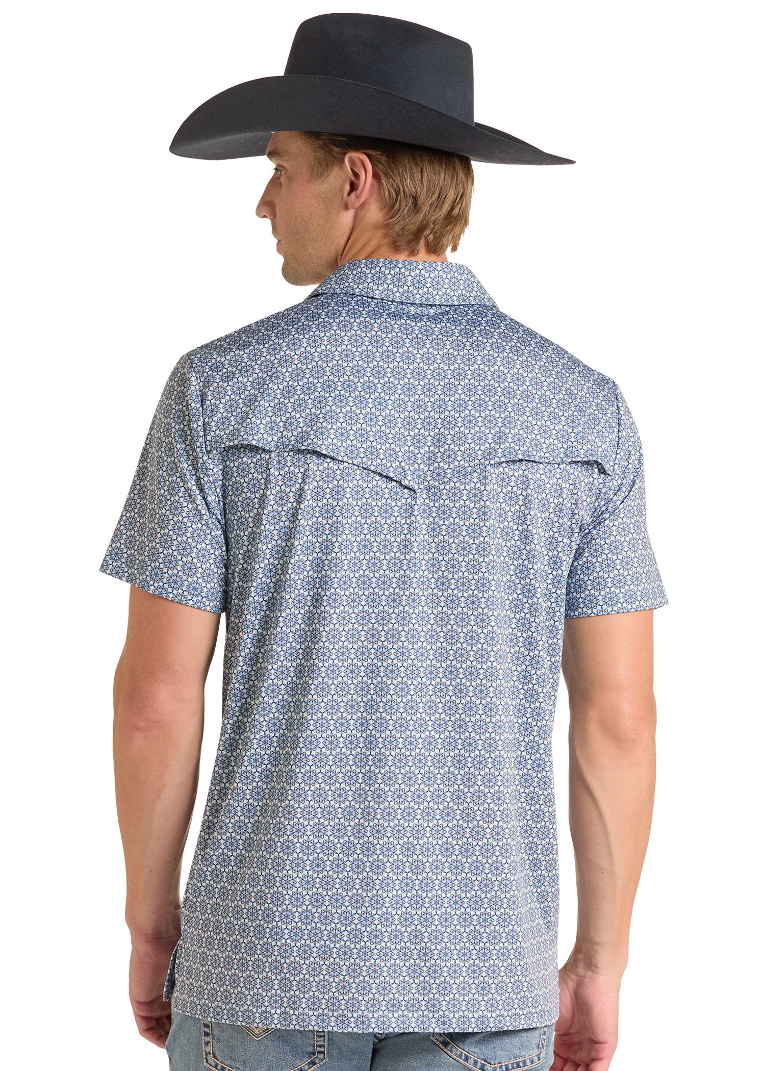 A man wearing a light blue and white geometric patterned short-sleeve button-down shirt, shown from the back. He is also wearing a black cowboy hat and light-wash jeans, photographed against a solid white background.