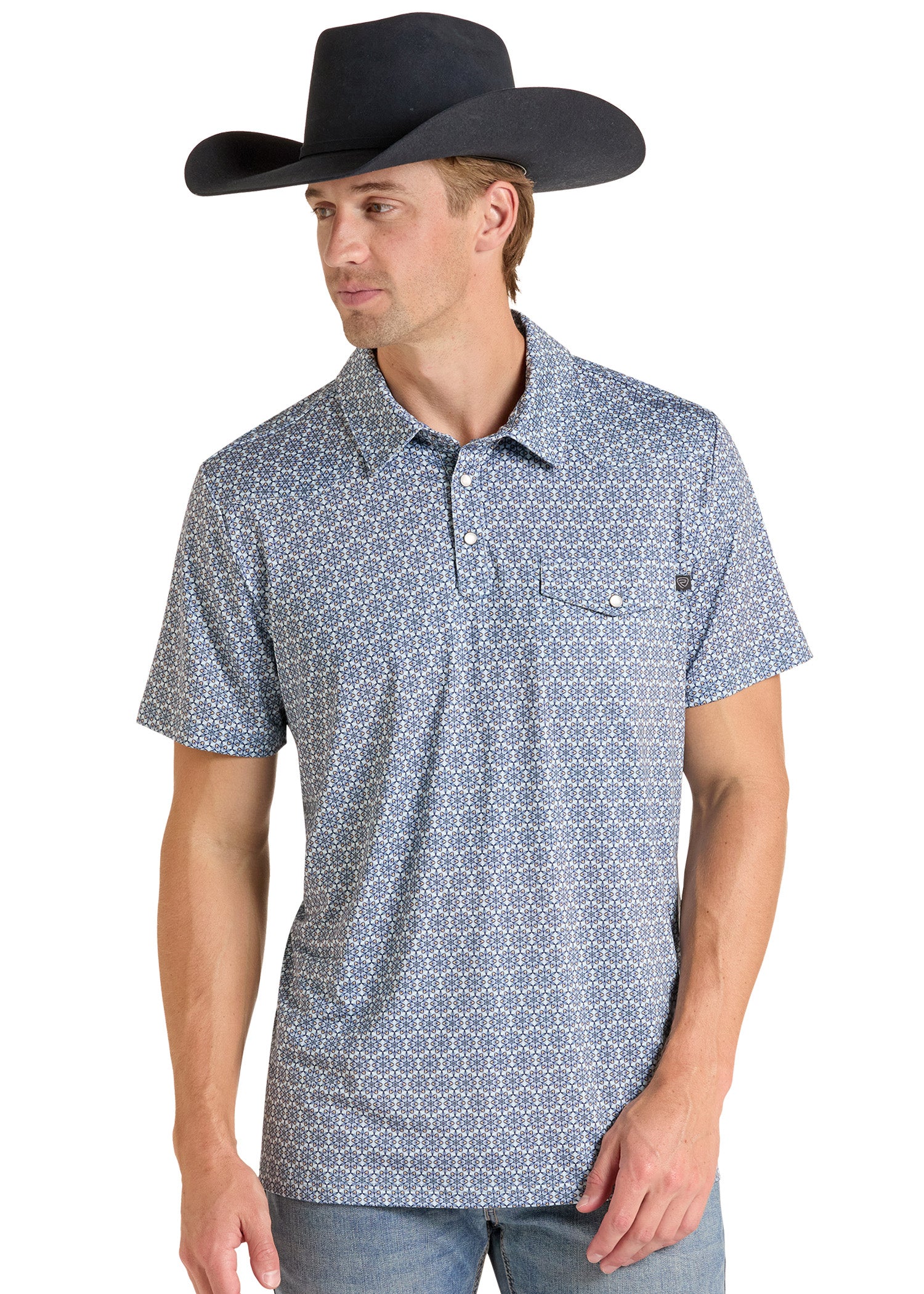A man wearing a black cowboy hat and a short-sleeve polo shirt with a blue and white geometric pattern, paired with blue jeans, photographed against a plain white background.