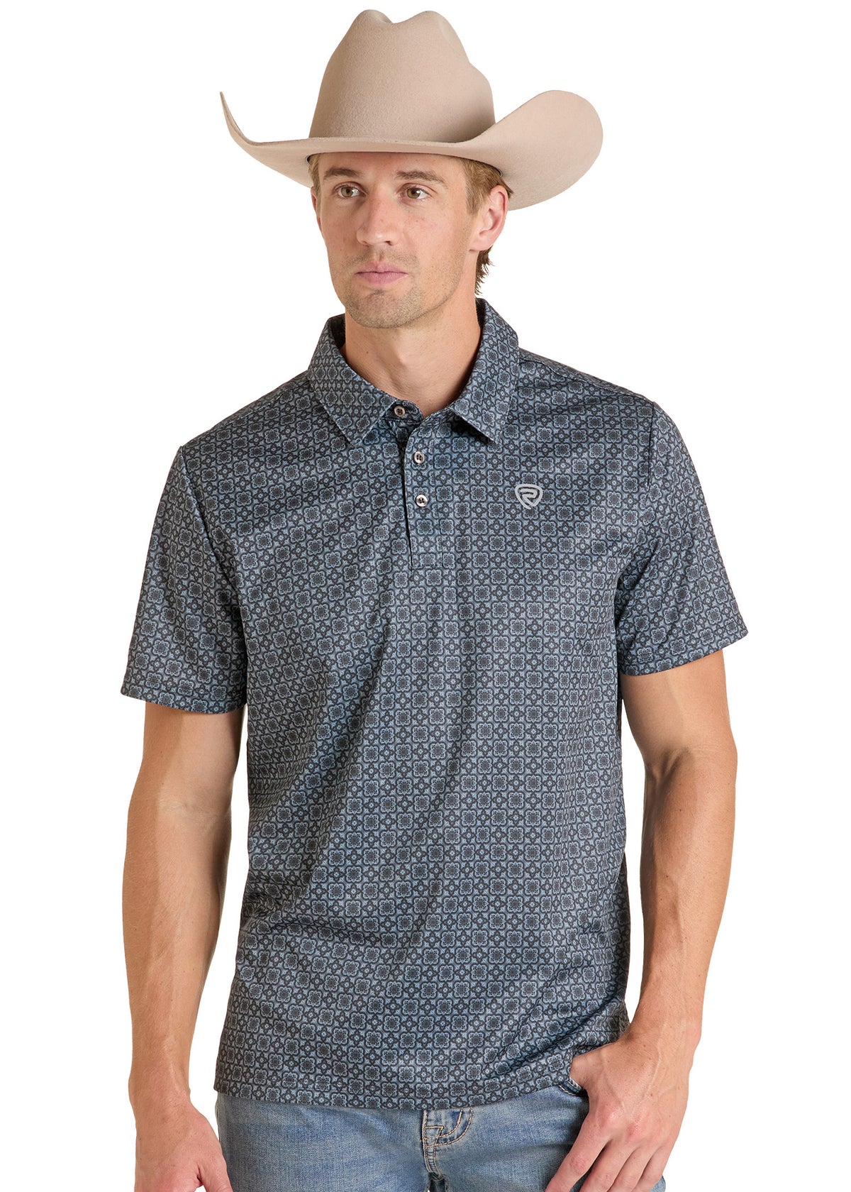 A man wearing a short-sleeve polo shirt with a small white geometric pattern.