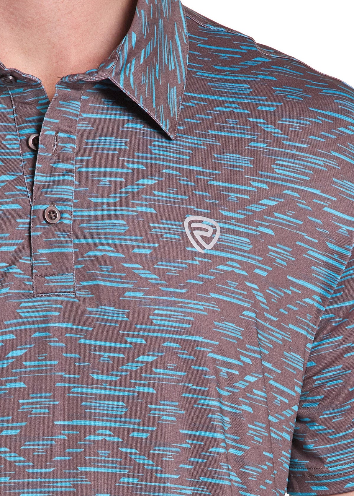 Close-up of a man wearing a short-sleeve polo shirt with a brown and light blue abstract patterned design and a small white shield logo on the chest.