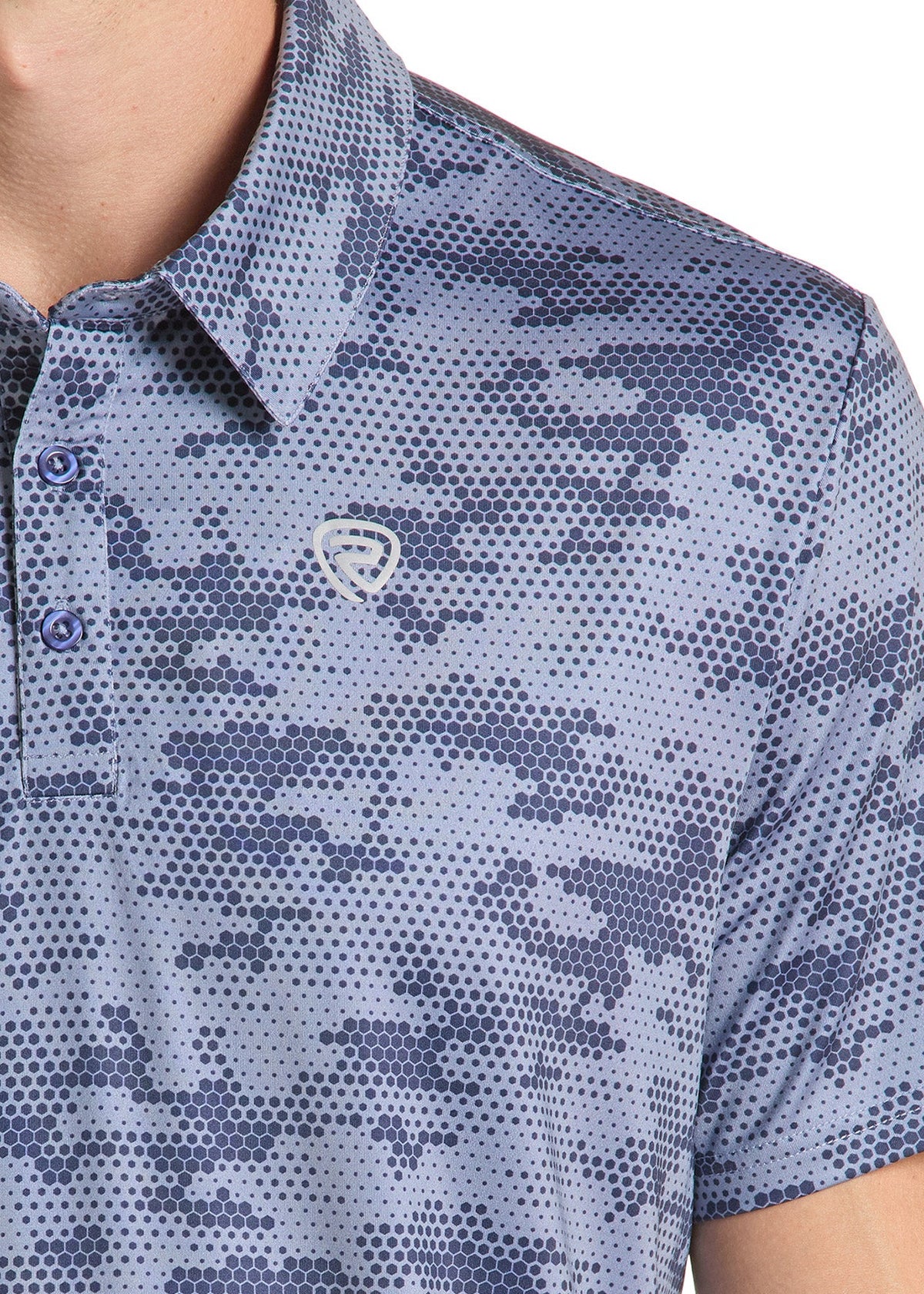 Close-up of a short-sleeve polo shirt with a blue and gray pixelated halftone pattern, featuring a small shield logo on the chest.