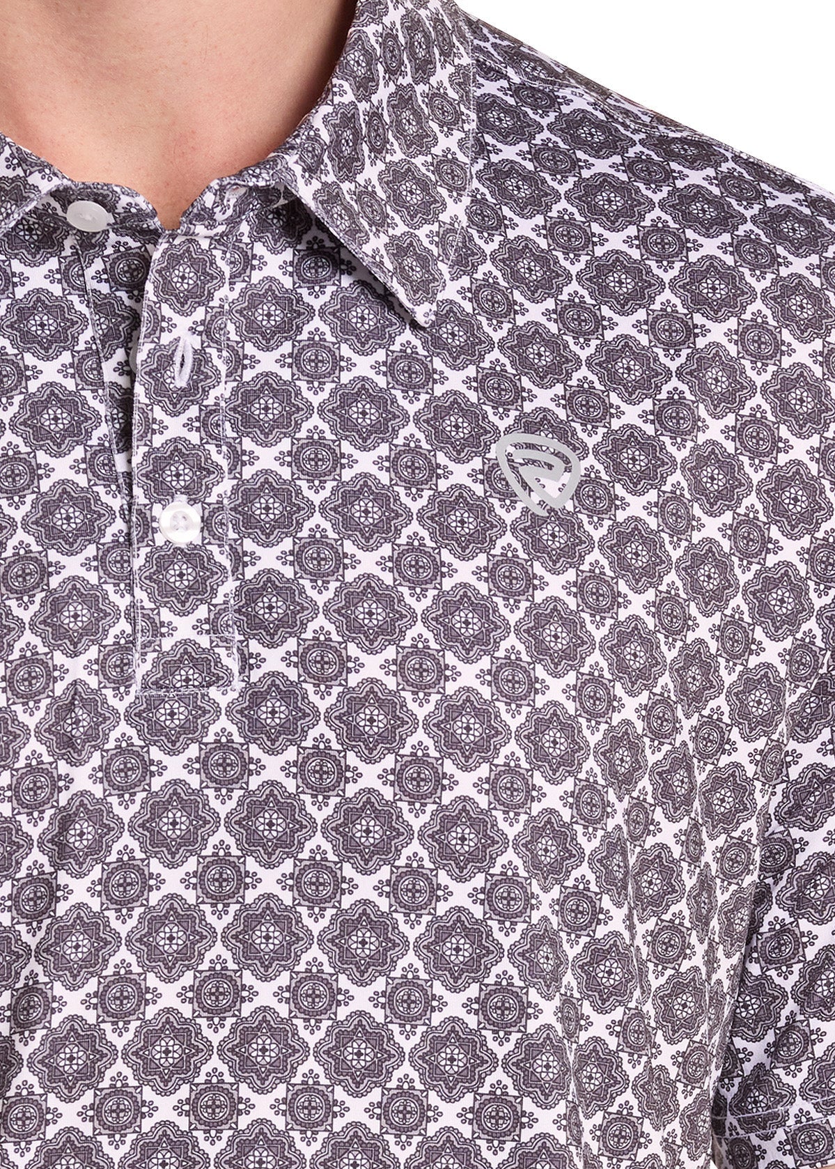 Close-up of a short-sleeve polo shirt with a repeating geometric pattern in dark gray and white, featuring a small embroidered logo on the left chest.