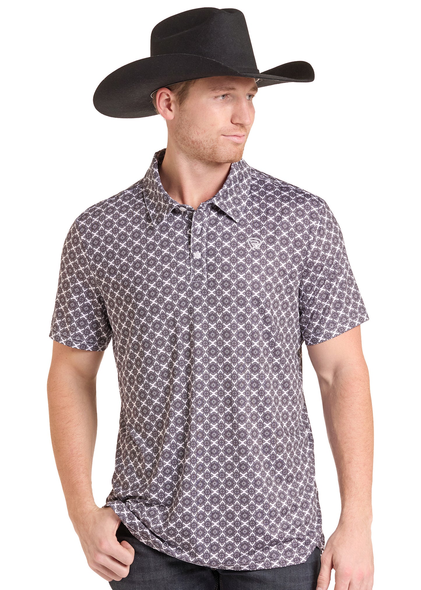 A man wearing a black cowboy hat and a short-sleeve polo shirt with a gray and white geometric pattern, photographed against a plain white background.
