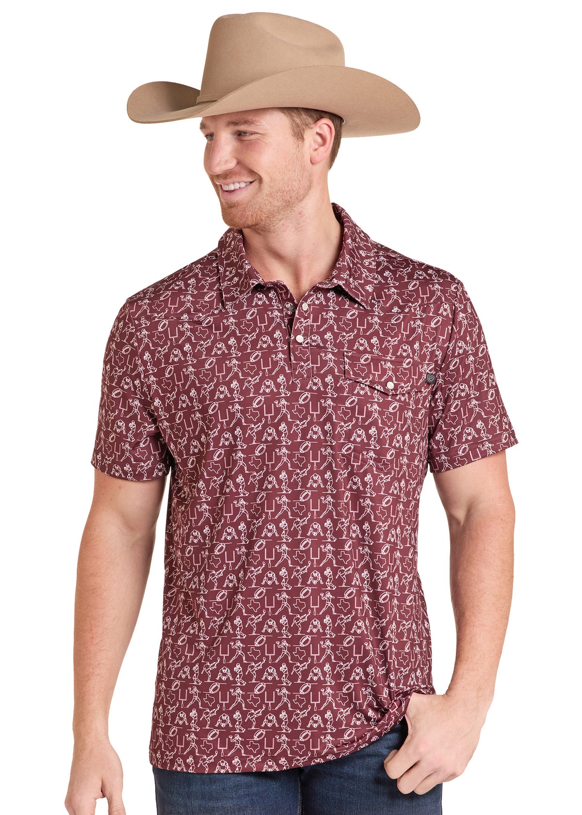 A man wearing a tan cowboy hat and a short-sleeve button-up shirt with a red and white paisley pattern, paired with dark blue jeans, photographed against a plain white background.