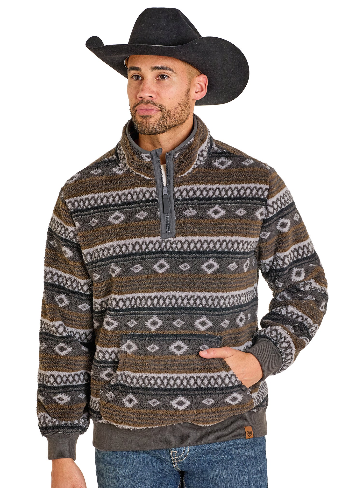 Man wearing a patterned sweater and cowboy hat on a white background