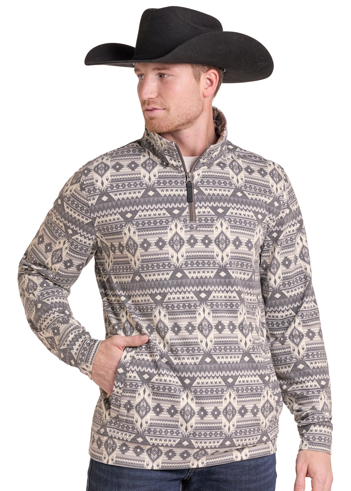 A man wearing a black cowboy hat and a quarter-zip long-sleeve pullover with a gray and beige geometric pattern, posed against a plain white background.