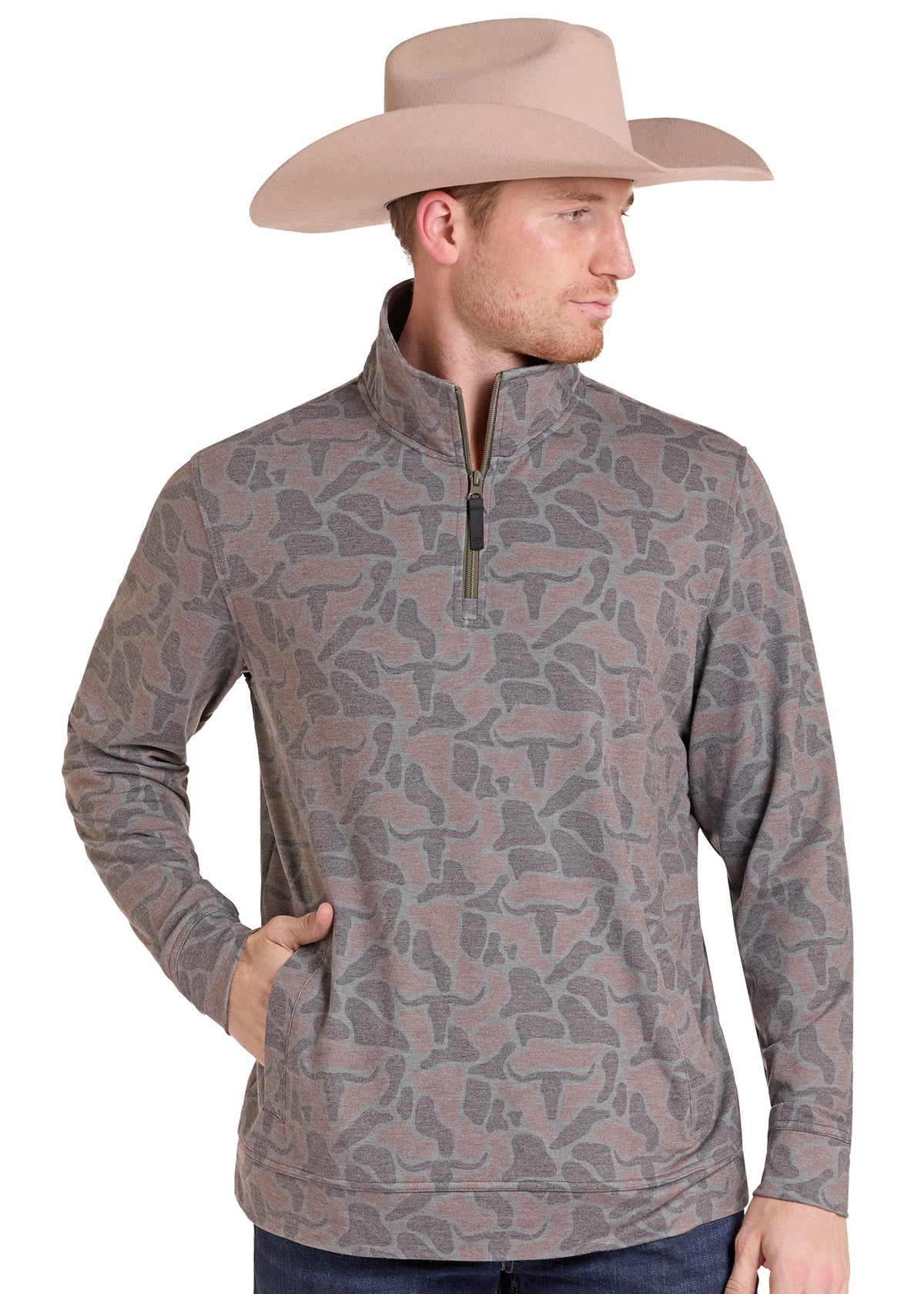 A man wearing a tan cowboy hat and a gray and brown camouflage patterned quarter-zip pullover sweater, shown from the waist up against a plain white background.
