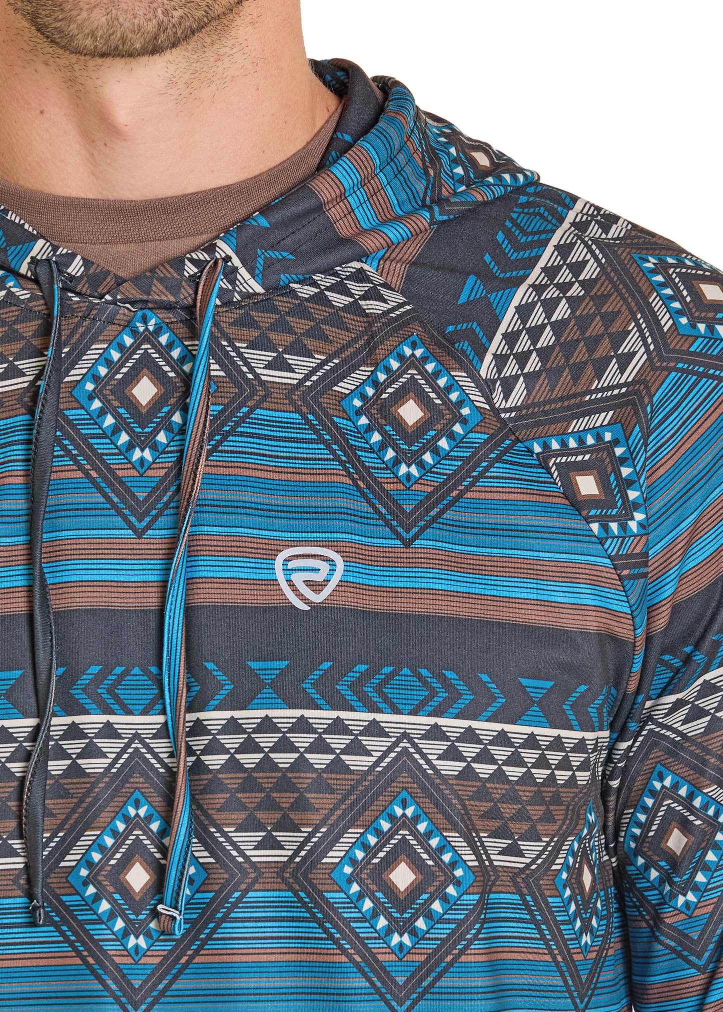 Close-up of a person wearing a patterned hoodie with a brand logo.