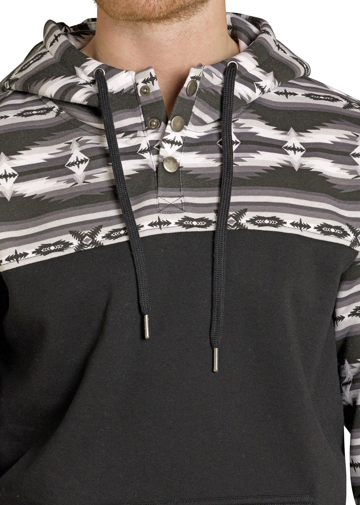 A close-up of a person in the Rock & Roll Denim Aztec Block Hoodie, featuring a black lower half, gray/black/white geometric upper pattern, and classic comfort with a drawstring and three-button neckline.