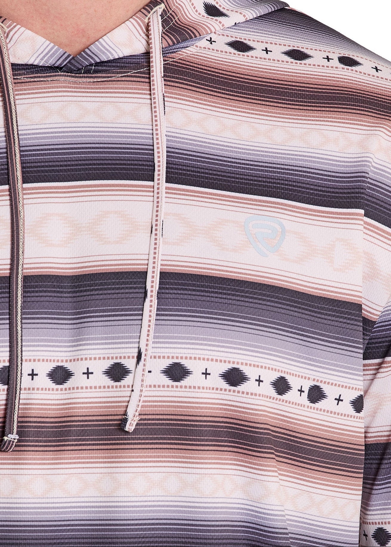 Close-up of a person wearing a patterned hoodie with horizontal stripes and geometric designs.