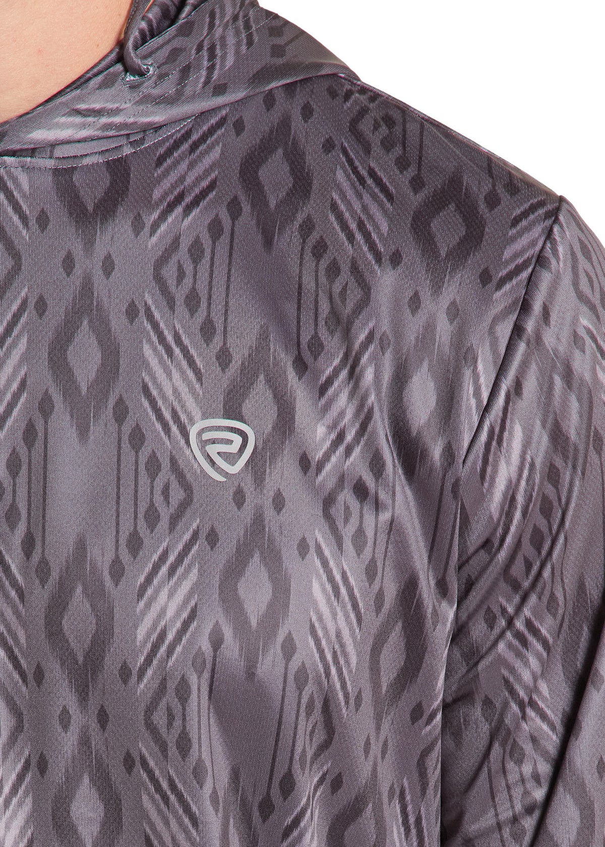 Close-up of a gray hooded athletic top with an allover geometric diamond pattern and a small shield logo on the chest, shown on a model against a white background.
