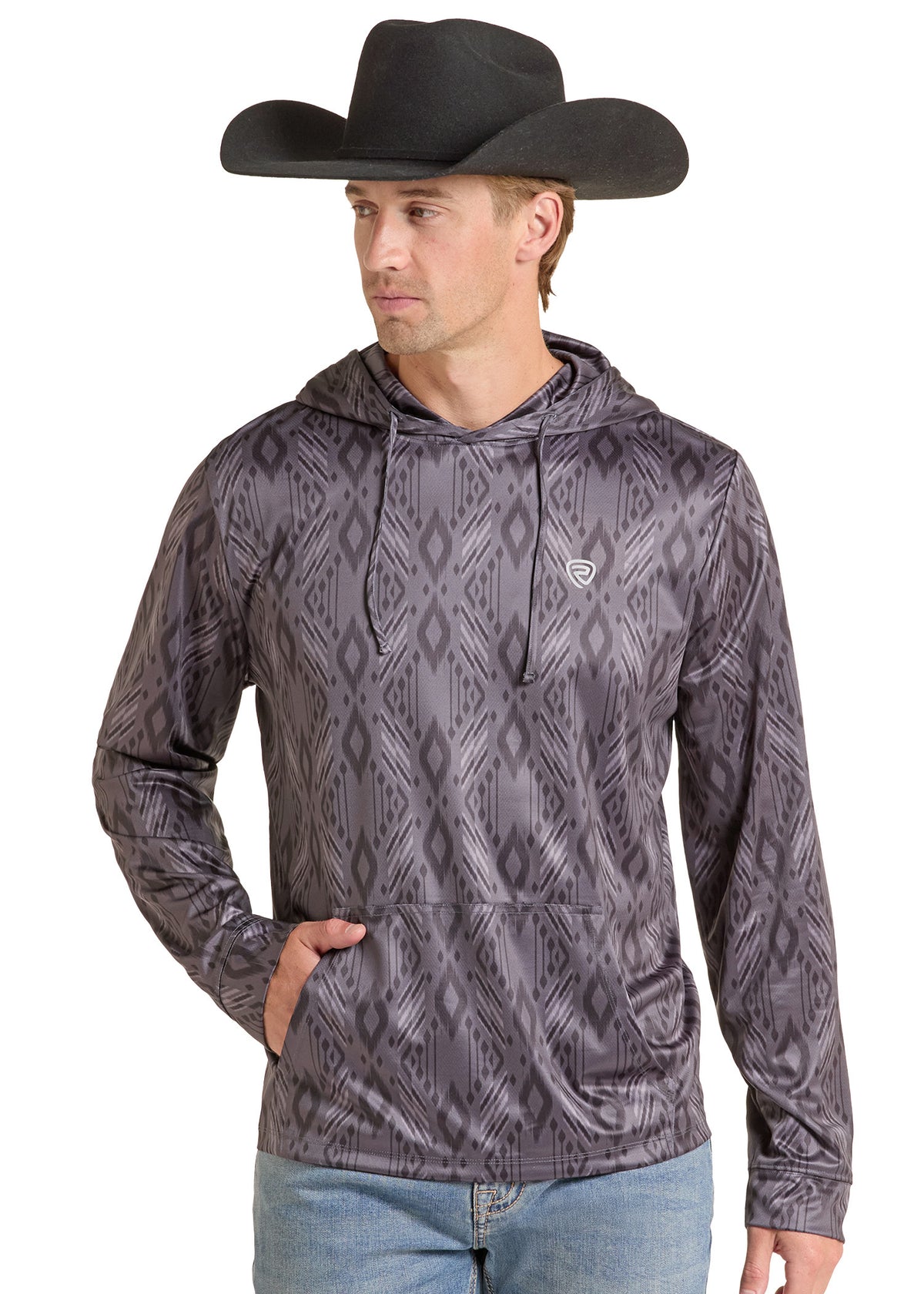 A man wearing a grey cowboy hat and a gray patterned long-sleeve hoodie with a drawstring hood and kangaroo pocket, paired with blue jeans, against a plain white background.