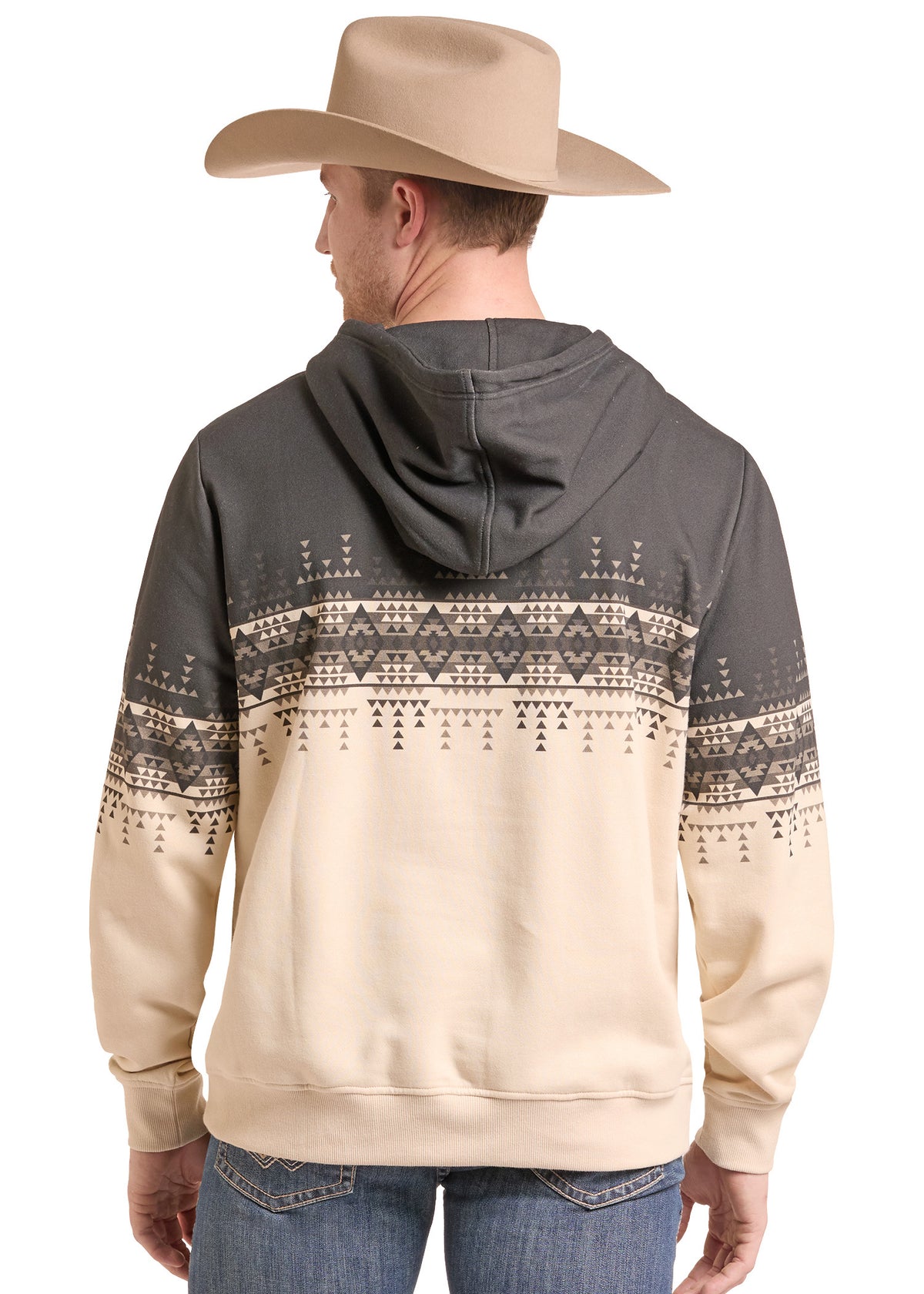 A man wearing a beige cowboy hat and a two-tone hoodie with a dark gray upper section and a beige lower section featuring a geometric pattern, shown from the back against a white background.