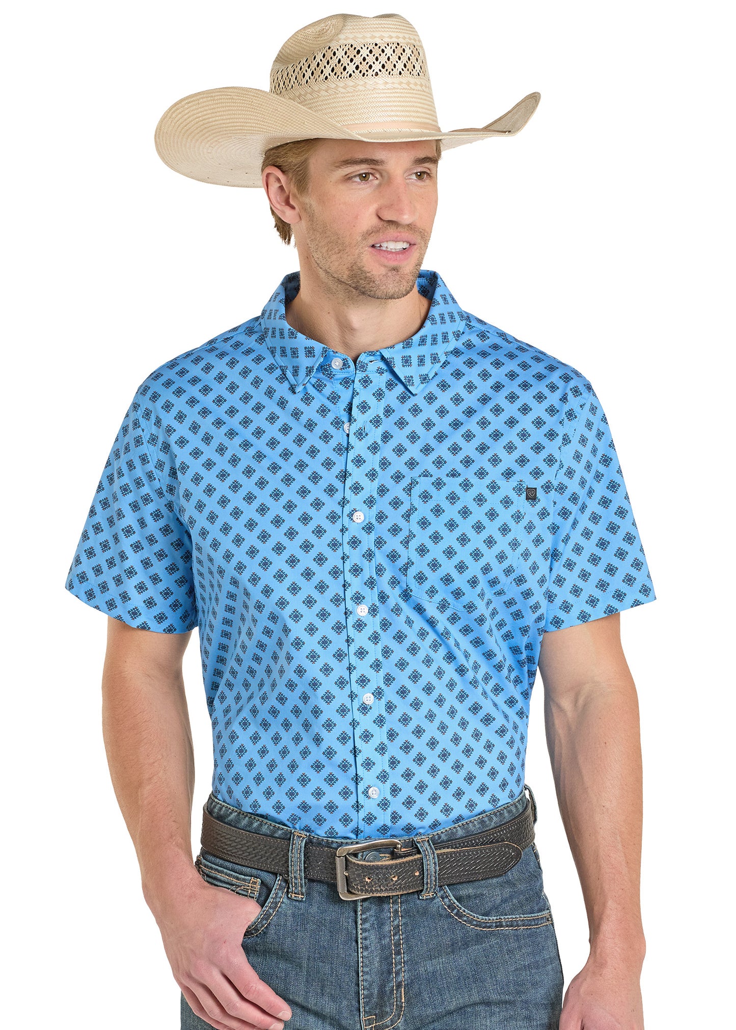 Man wearing a blue Aztec patterned shirt and cowboy hat on a white background